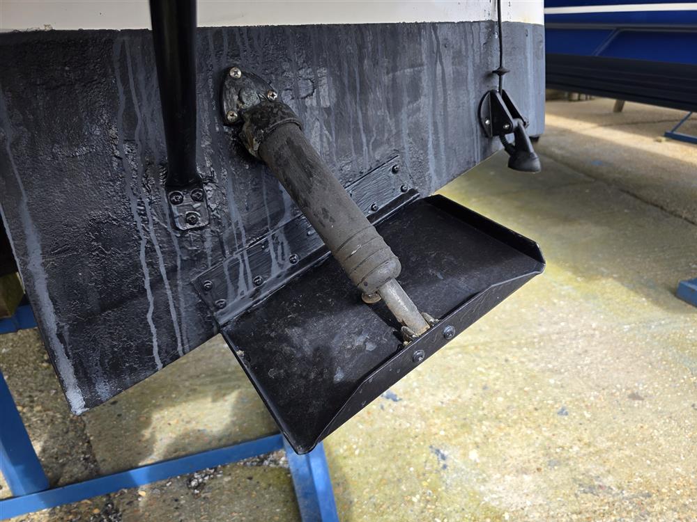 Trim tabs mounted on the transom of Lucky Enough